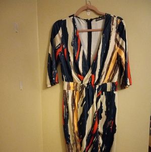 Women's fitted multi color dress. Slit in the middle. Size L never worn